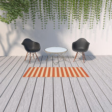Load image into Gallery viewer, 5&#39; x 8&#39; Orange and Ivory Indoor Outdoor Area Rug