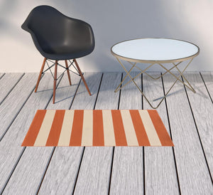 5' x 8' Orange and Ivory Indoor Outdoor Area Rug